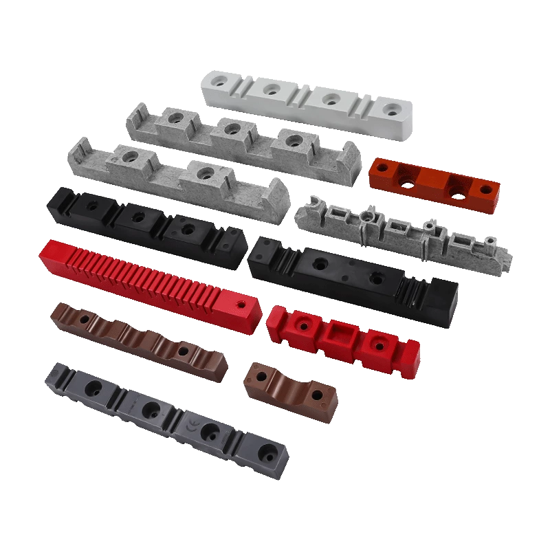 Various insulator support components in different shapes, sizes, and colors, including red, black, brown, gray, and white.